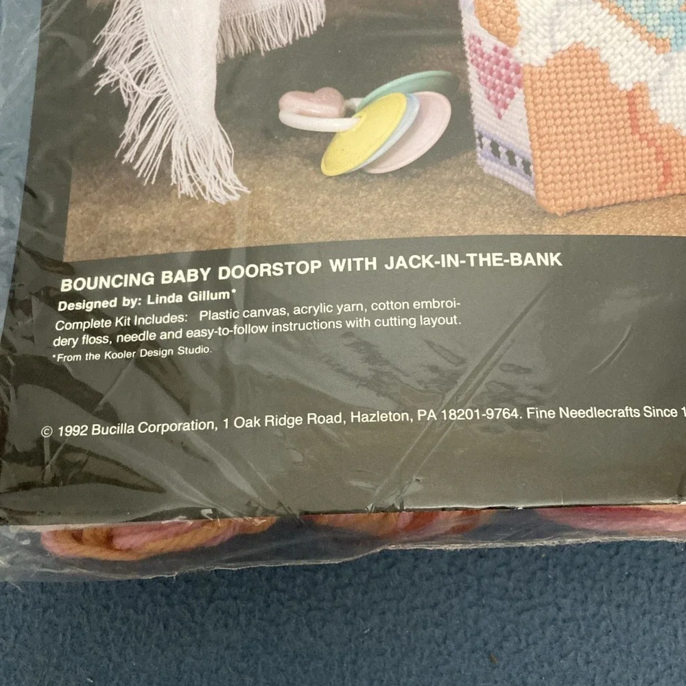 VTG/CIB Bucilla Plastic Canvas Bouncing Baby Doorstop w/Jack-In-The-Bank #6094